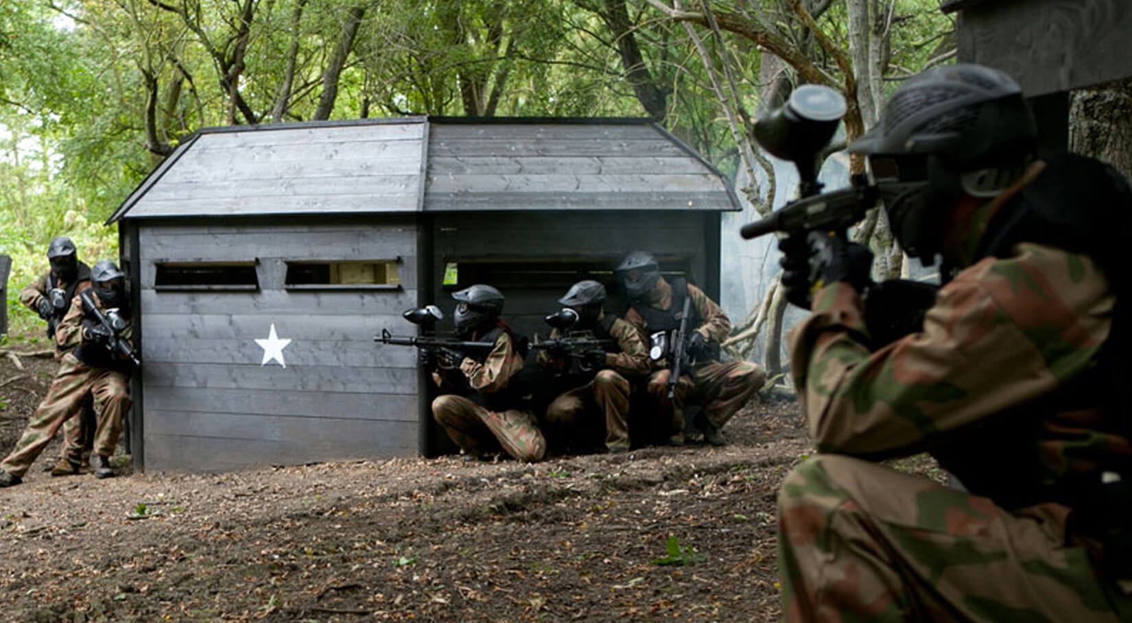 A team in a woodland paintball game